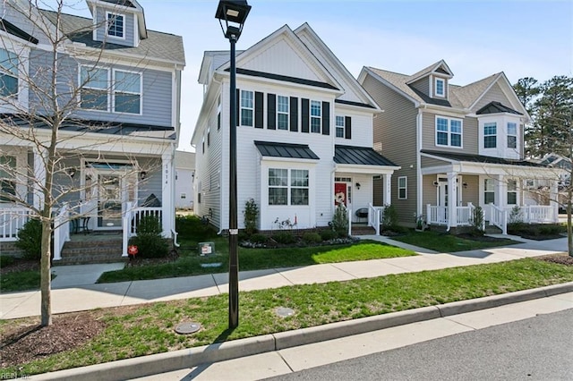 1012 Chartwell Dr, Newport News, VA 23608 - view of front of home featuring a standing seam roof and a front lawn