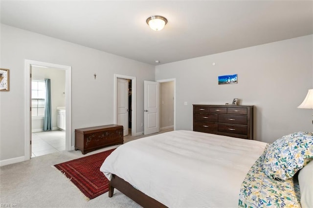 1012 Chartwell Dr, Newport News, VA 23608 - carpeted bedroom with baseboards and ensuite bathroom