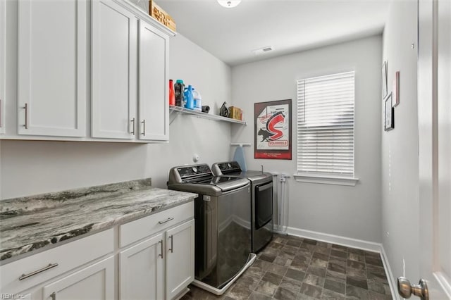 1012 Chartwell Dr, Newport News, VA 23608 - clothes washing area with stone finish floor, baseboards, separate washer and dryer, visible vents, and cabinet space