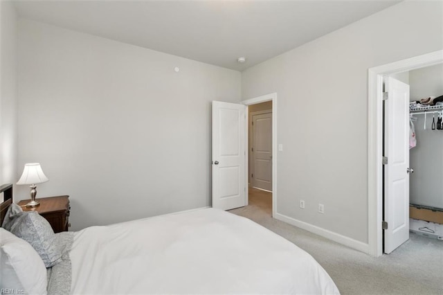 1012 Chartwell Dr, Newport News, VA 23608 - bedroom with baseboards, a spacious closet, and light colored carpet