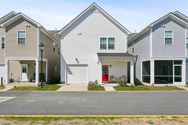 1012 Chartwell Dr, Newport News, VA 23608 - view of front of house featuring a sunroom and an attached garage