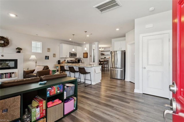 1012 Chartwell Dr, Newport News, VA 23608 - living area featuring visible vents, wood finished floors, and recessed lighting