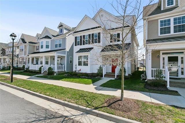 1012 Chartwell Dr, Newport News, VA 23608 - view of property with covered porch, a residential view, and a front yard