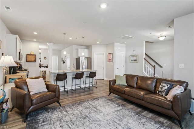 1012 Chartwell Dr, Newport News, VA 23608 - living area with dark wood-style flooring, visible vents, baseboards, stairway, and recessed lighting