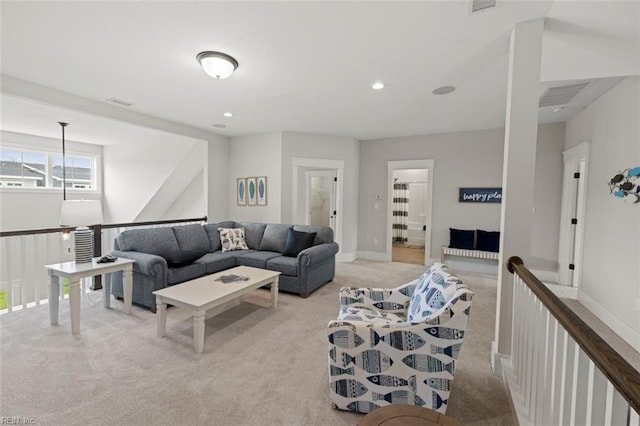 living room with recessed lighting, light carpet, baseboards, and visible vents