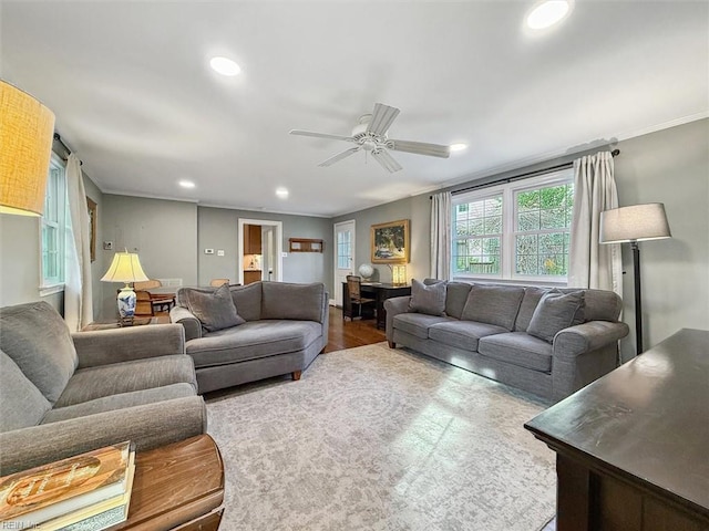 living room featuring crown molding, wood finished floors, recessed lighting, and a ceiling fan