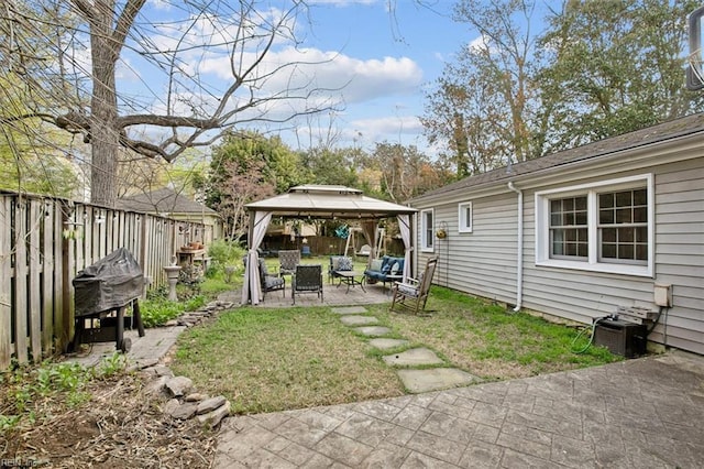 view of yard with a fenced backyard, central air condition unit, a gazebo, and a patio