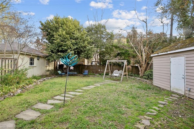 view of yard featuring an outbuilding and a fenced backyard