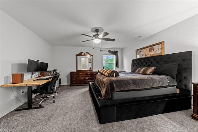 carpeted bedroom featuring baseboards, a ceiling fan, and visible vents