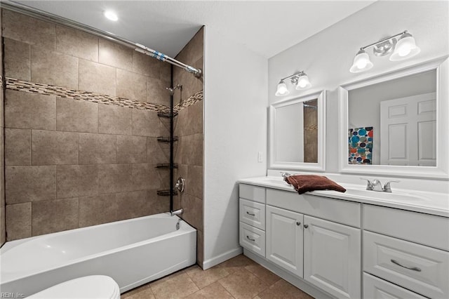 full bathroom featuring baseboards, toilet,  shower combination, vanity, and tile patterned floors