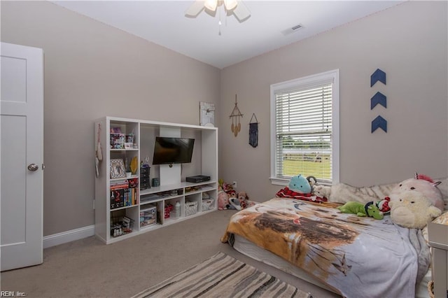carpeted bedroom with ceiling fan and visible vents
