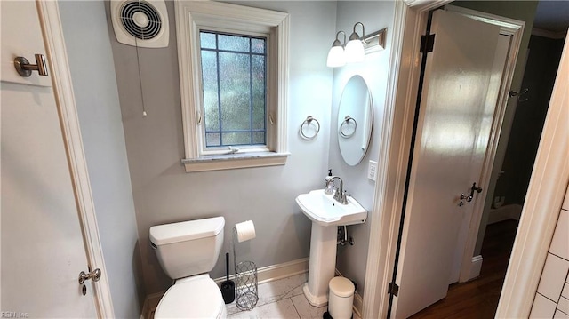 bathroom featuring baseboards, visible vents, and toilet