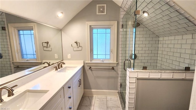 bathroom featuring visible vents, lofted ceiling, a sink, and marble finish floor