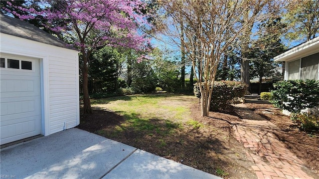 view of yard featuring a garage
