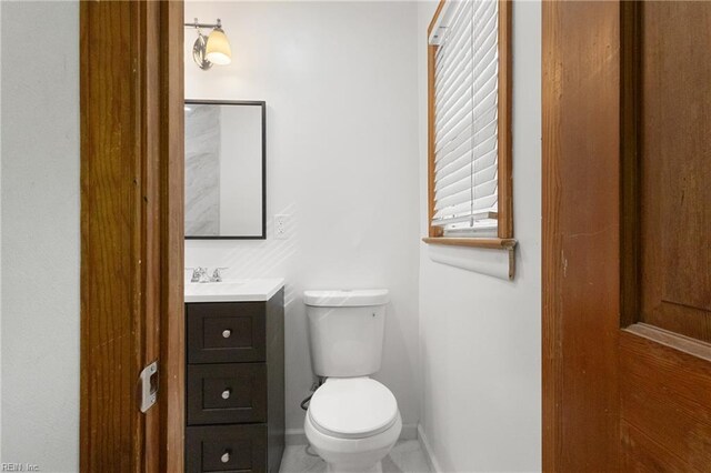 111 Garrett Dr, Hampton, VA 23669 - bathroom featuring baseboards, toilet, and vanity