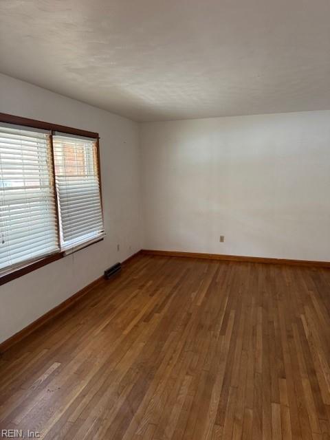 111 Garrett Dr, Hampton, VA 23669 - unfurnished room with baseboards and wood finished floors