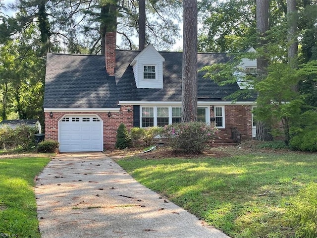 418 Pin Oak Rd, Newport News, VA 23601 - cape cod home featuring an attached garage, a chimney, brick siding, a front lawn, and driveway