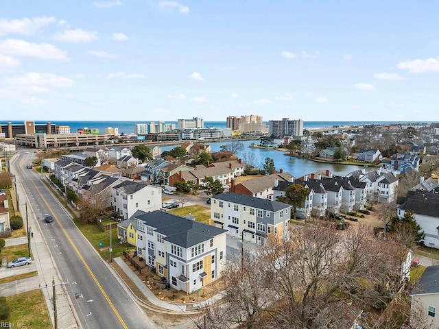 bird's eye view featuring a water view and a view of city