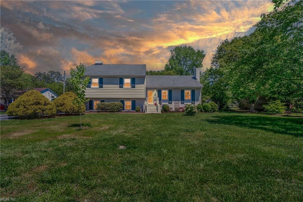 304 Robinhood Rd, Franklin, VA 23851 - split level home with a lawn and a chimney