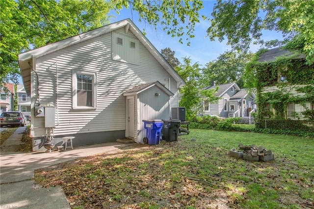 back of house with a yard