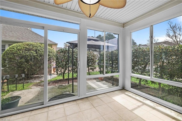 unfurnished sunroom with tile patterned floors