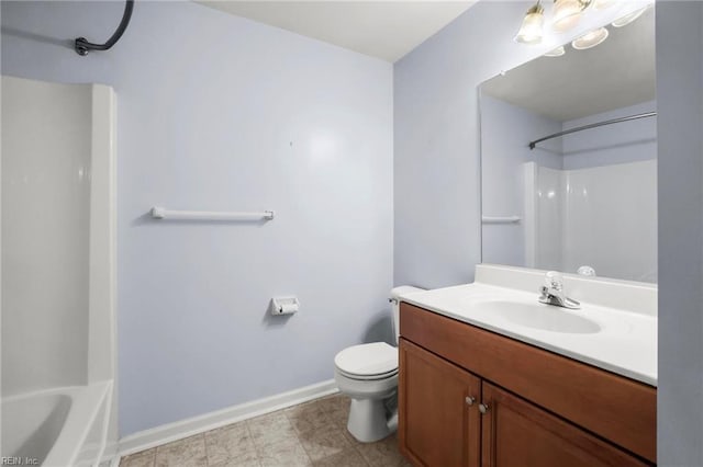 bathroom with baseboards, toilet, shower / tub combination, and vanity