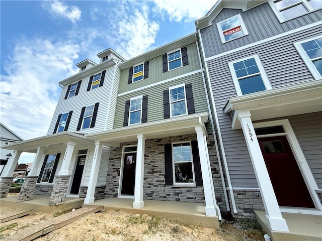 1396 Independence Blvd, Newport News, VA 23608 - townhome / multi-family property featuring board and batten siding, stone siding, and covered porch