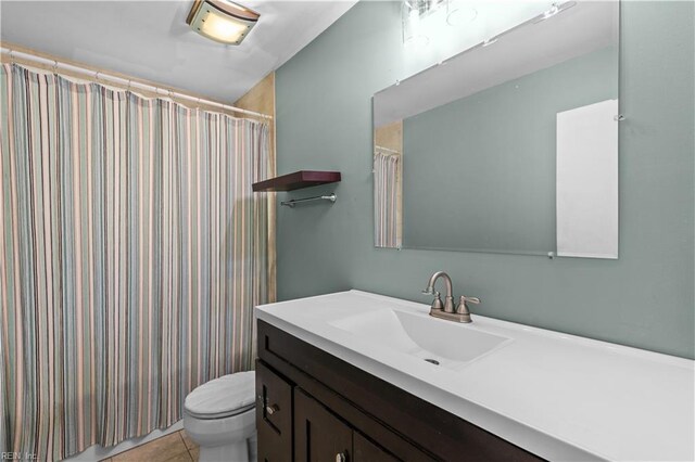 1917 Kensington Dr, Hampton, VA 23663 - full bath with curtained shower, toilet, tile patterned flooring, and vanity