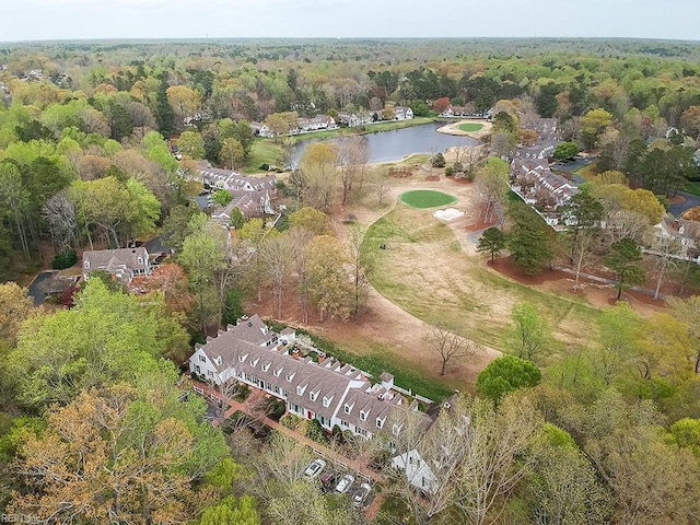 drone / aerial view with a water view and a wooded view