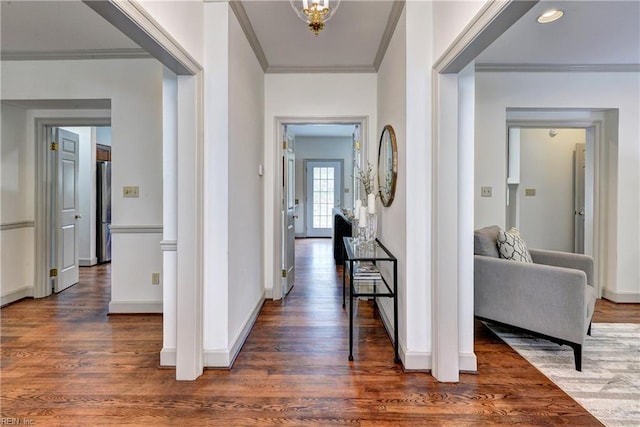 corridor featuring crown molding and wood finished floors