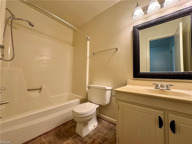 full bath featuring baseboards, toilet, tile patterned floors, vanity, and bathing tub / shower combination