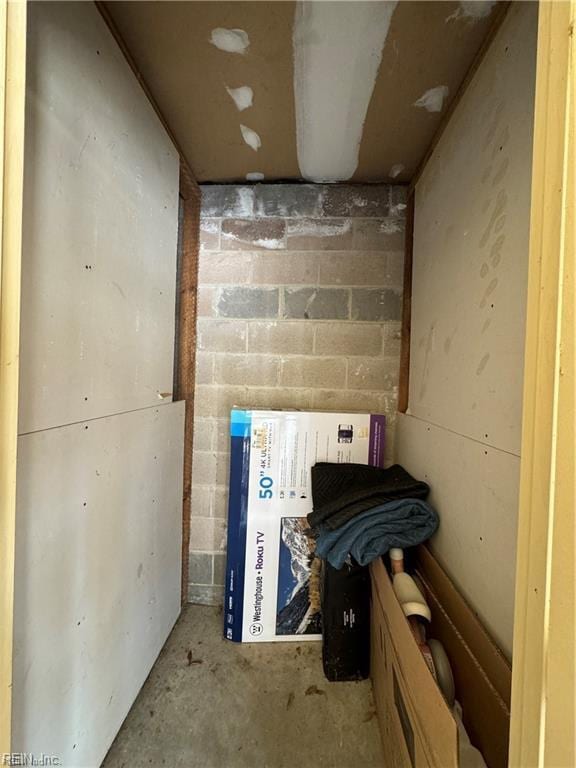interior space featuring concrete block wall
