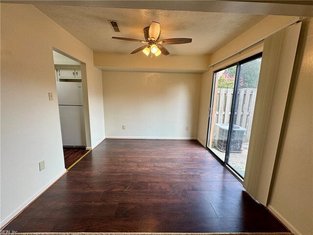 unfurnished room with wood finished floors, a textured ceiling, and ceiling fan