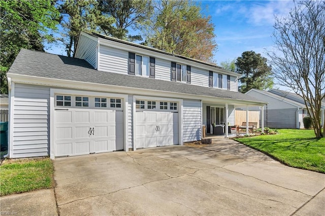 view of front of home featuring concrete driveway, a shingled roof, a garage, and a front lawn