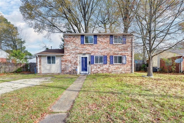 1413 Seward Dr, Hampton, VA 23663 - traditional-style home featuring brick siding, fence, and a front lawn