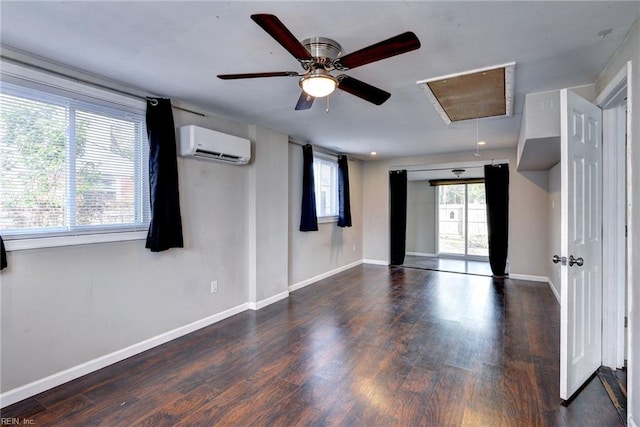 1413 Seward Dr, Hampton, VA 23663 - empty room with a wall mounted AC, baseboards, ceiling fan, wood finished floors, and attic access
