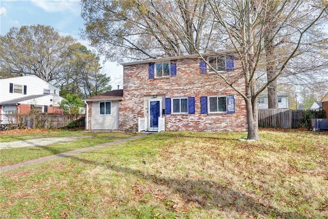 1413 Seward Dr, Hampton, VA 23663 - view of front of home featuring brick siding, fence, central AC unit, and a front yard