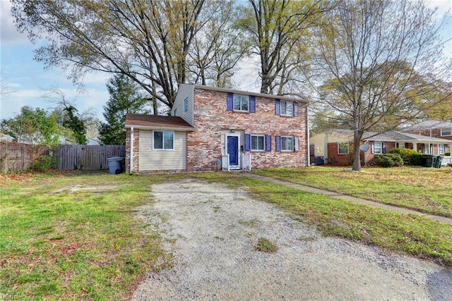 1413 Seward Dr, Hampton, VA 23663 - view of front of house with fence and a front yard