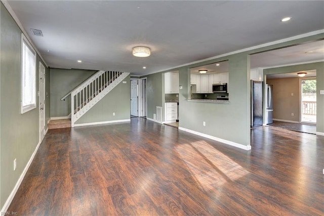 1413 Seward Dr, Hampton, VA 23663 - unfurnished living room with visible vents, ornamental molding, baseboards, and wood finished floors
