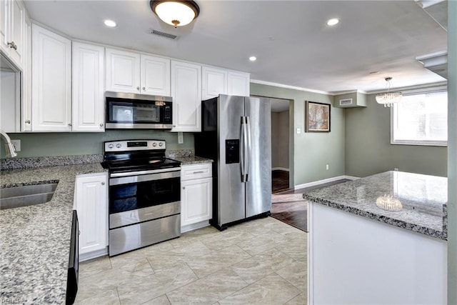 1413 Seward Dr, Hampton, VA 23663 - kitchen with light stone counters, a sink, white cabinetry, stainless steel appliances, and visible vents