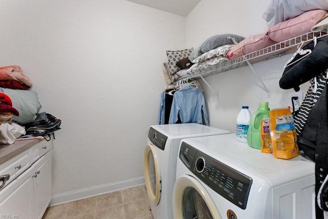 940 Sugar Oak Dr, Virginia Beach, VA 23462 - clothes washing area featuring baseboards, washing machine and dryer, cabinet space, and light tile patterned floors