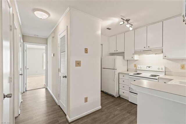 3955 Palomino Dr Unit 201, Newport News, VA 23602 - kitchen featuring wood finished floors, under cabinet range hood, white appliances, white cabinets, and decorative backsplash