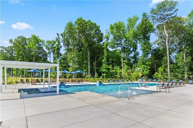 pool with fence, a patio, and a pergola