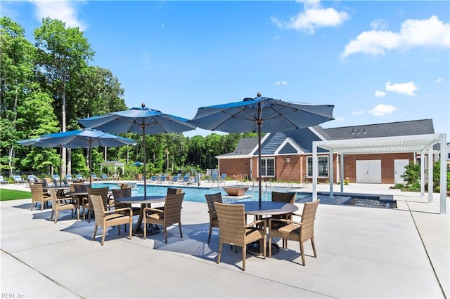 pool featuring fence, a pergola, outdoor dining space, and a patio