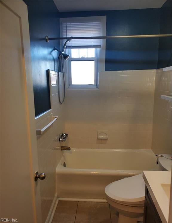 bathroom with toilet, bathtub / shower combination, tile patterned flooring, and vanity