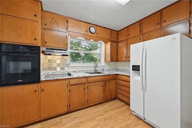 8084 Lynnbrook Dr, Norfolk, VA 23518 - kitchen featuring black appliances, a sink, under cabinet range hood, light wood finished floors, and light countertops