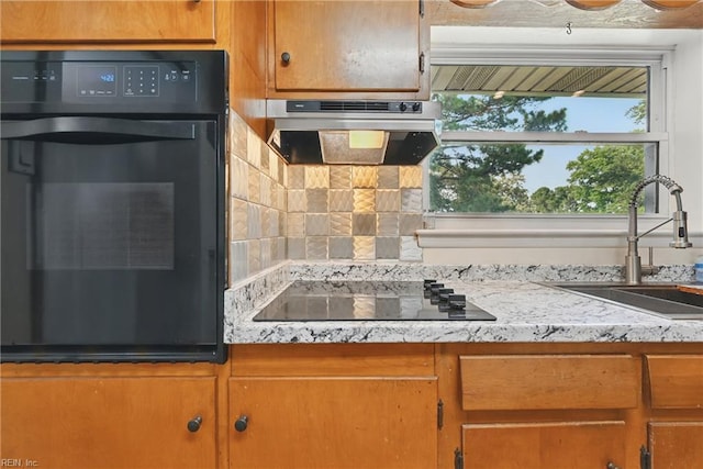 8084 Lynnbrook Dr, Norfolk, VA 23518 - kitchen featuring exhaust hood, black appliances, a sink, decorative backsplash, and light countertops