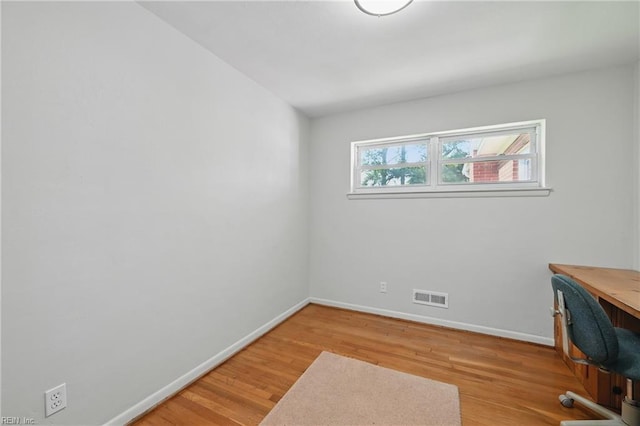 8084 Lynnbrook Dr, Norfolk, VA 23518 - unfurnished office with baseboards and light wood-style flooring