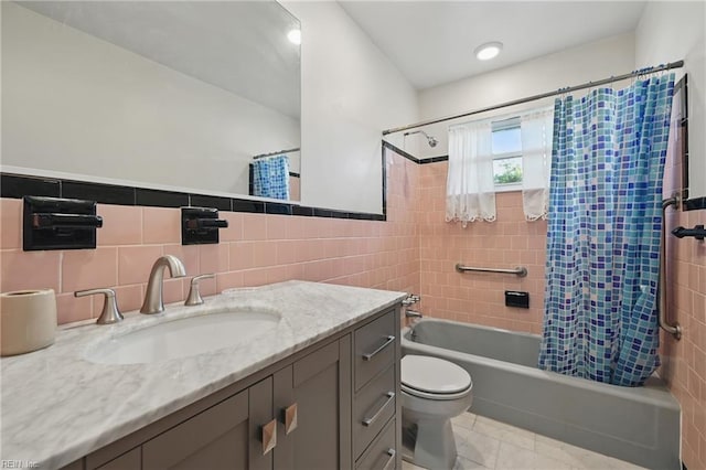 8084 Lynnbrook Dr, Norfolk, VA 23518 - bathroom featuring tile walls, shower / bathtub combination with curtain, toilet, vanity, and tile patterned flooring