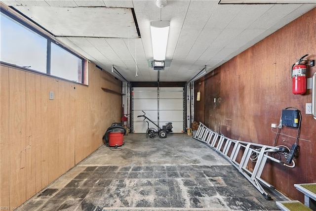 8084 Lynnbrook Dr, Norfolk, VA 23518 - garage with wood walls and a garage door opener